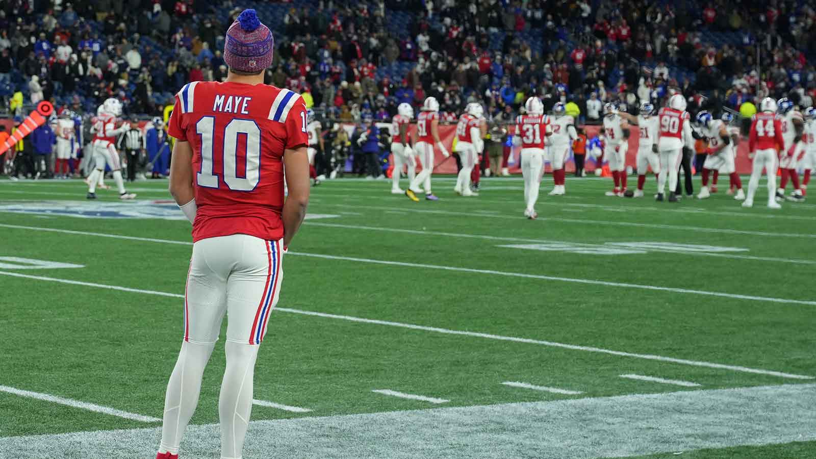 New England Patriots quarterback Drake Maye (10) watches from the sideline during the fourth quarter against the New York Giants at Gillette Stadium.