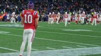 New England Patriots quarterback Drake Maye (10) watches from the sideline during the fourth quarter against the New York Giants at Gillette Stadium.