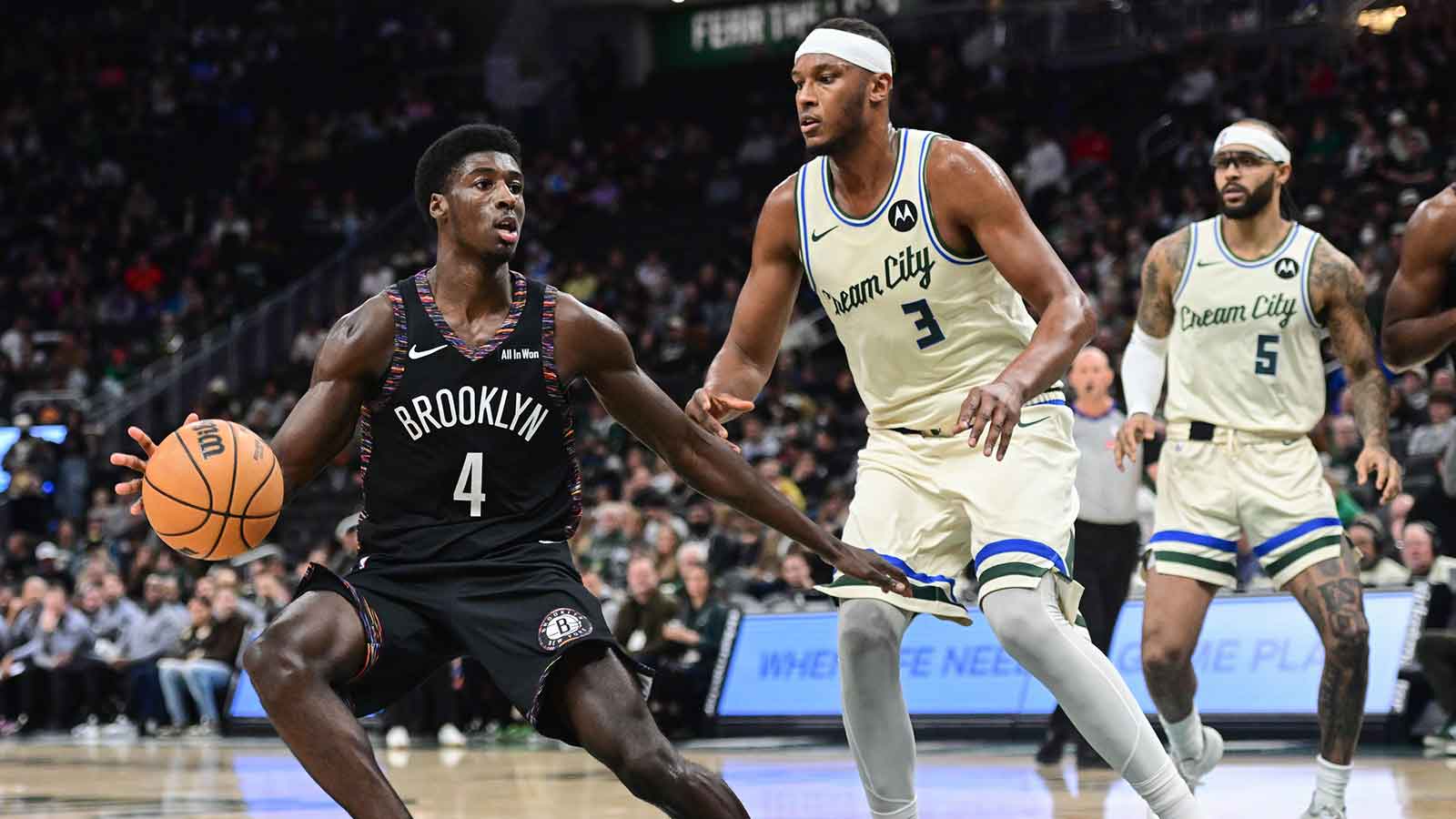 Brooklyn Nets guard Drake Powell (4) looks for a shot against Milwaukee Bucks center Myles Turner (3) in the third quarter at Fiserv Forum.
