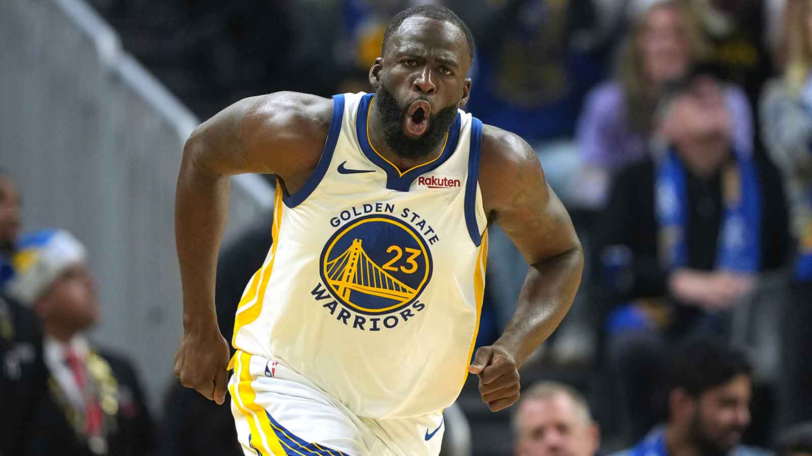 Golden State Warriors forward Draymond Green (23) reacts after making a three point basket against the Dallas Mavericks during the second quarter at Chase Center.