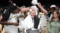 Players celebrates with Michigan Wolverines head coach Dusty May after defeating the Gonzaga Bulldogs in the 2025 Players Era Festival championship game at MGM Grand Garden Arena.