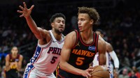Atlanta Hawks guard Dyson Daniels (5) looks to pass against Philadelphia 76ers guard Quentin Grimes (5) during the third quarter at State Farm Arena.