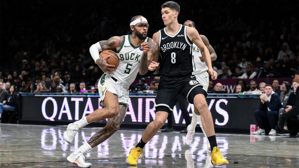 Dec 14, 2025; Brooklyn, New York, USA; Milwaukee Bucks guard Gary Trent Jr. (5) drives to the basket defended by Brooklyn Nets guard Egor Demin (8) during the first half at Barclays Center. Mandatory Credit: John Jones-Imagn Images