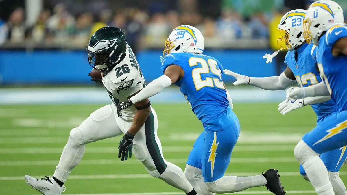 Philadelphia Eagles running back Saquon Barkley (26) runs against Los Angeles Chargers cornerback Tarheeb Still (29) in the second half at SoFi Stadium.