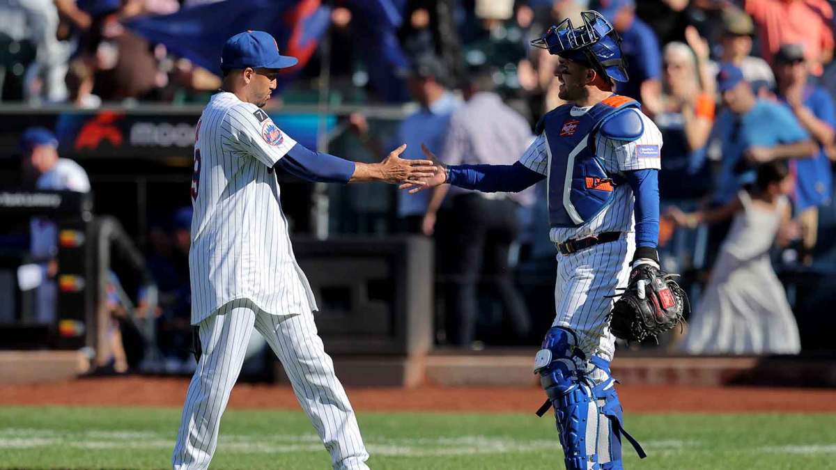 New York Mets relief pitcher Edwin Diaz (39) and catcher Luis Torrens (13) celebrate after defeating the San Diego Padres at Citi Field.