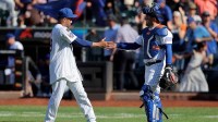New York Mets relief pitcher Edwin Diaz (39) and catcher Luis Torrens (13) celebrate after defeating the San Diego Padres at Citi Field.