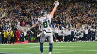 Dec 18, 2025; Seattle, Washington, USA; Seattle Seahawks tight end Eric Saubert (81) makes a catch for a game-winning two-point conversion against the Los Angeles Rams in overtime at Lumen Field.