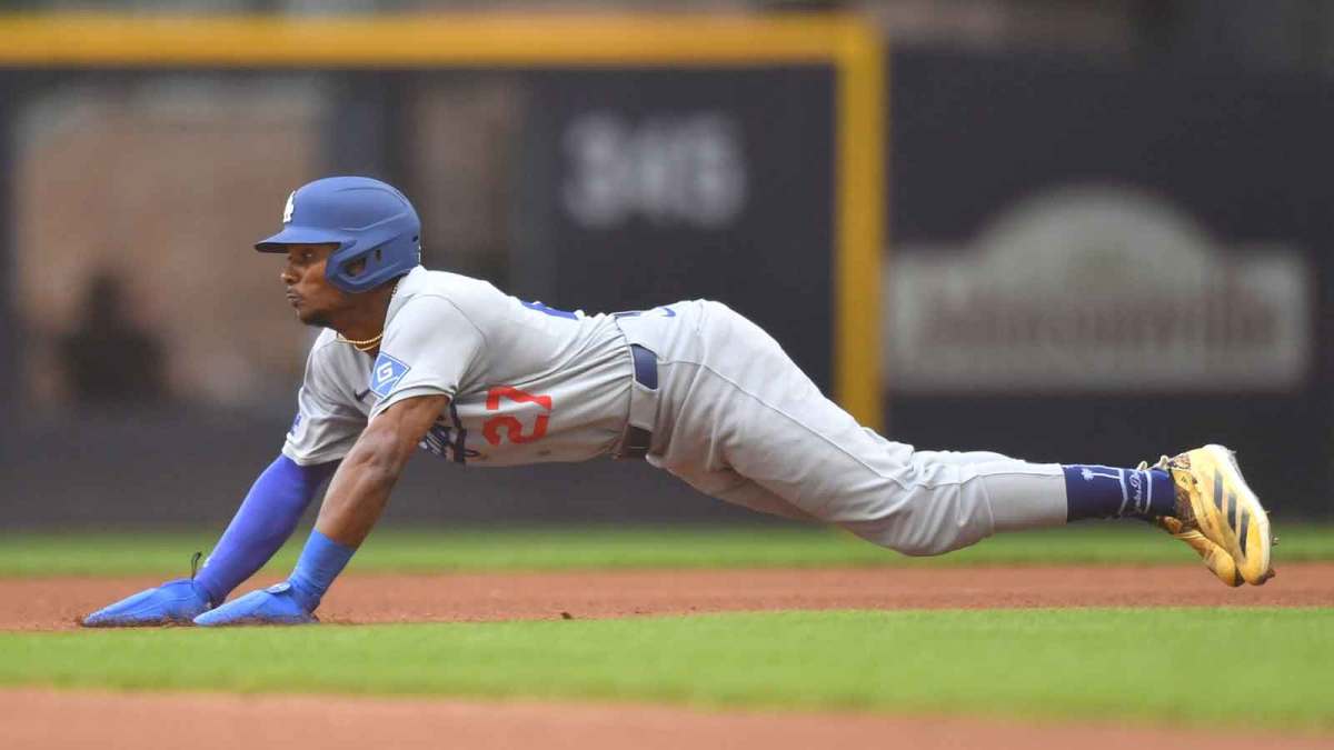 Los Angeles Dodgers left fielder Esteury Ruiz (27) slides to steal second base during the fifth inning against the Milwaukee Brewers at American Family Field.