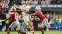 Indiana Hoosiers quarterback Fernando Mendoza (15) looks to throw as Ohio State Buckeyes safety Jaylen McClain (18) and Ohio State Buckeyes linebacker Sonny Styles (0) move in Saturday, Dec. 6, 2025, during the Big Ten football championship at Lucas Oil Stadium in Indianapolis.
