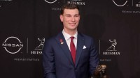 Indiana Hoosiers quarterback Fernando Mendoza poses with the Heisman trophy during a press conference at the New York Marriott Marquis.