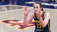 Indiana Fever guard Caitlin Clark (22) claps her hands in excitement Sunday, July 13, 2025, during the game at Gainbridge Fieldhouse