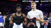 Philadelphia 76ers guard Vj Edgecombe (L) and Dallas Mavericks forward Cooper Flagg (R) swap jerseys after the game at Xfinity Mobile Arena.