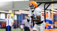 Florida Gators tight end Amir Jackson (7) runs with the ball during fall football practice at Sanders Indoor Practice Facility at the University of Florida in Gainesville, FL on Thursday, August 14, 2025