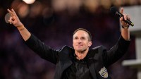 New Orleans Saints retired quarterback Drew Brees (9) reacts during his hall of fame ceremony at halftime against the Denver Broncos at Caesars Superdome.