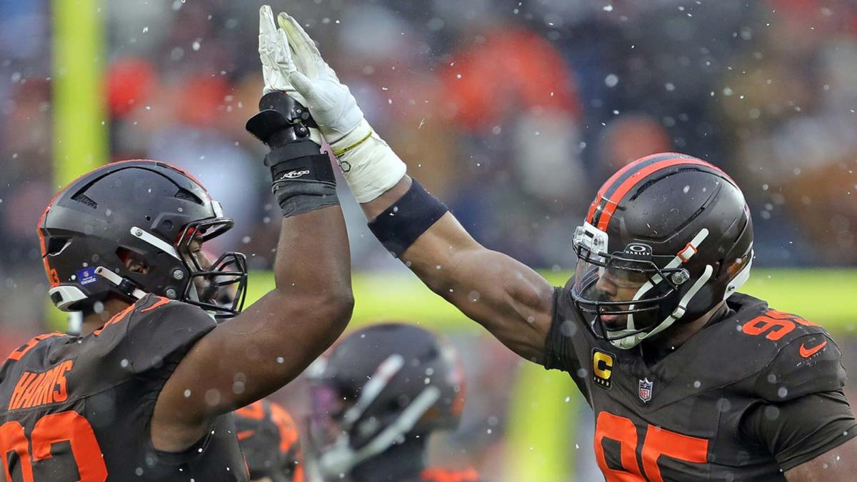 Cleveland Browns defensive end Myles Garrett (95) celebrates with defensive tackle Shelby Harris (93) after a sack during the first half of an NFL football game against the Tennessee Titans at Huntington Bank Field, Dec. 7, 2025, in Cleveland, Ohio.