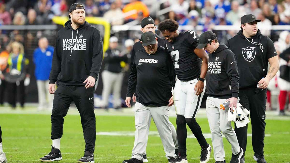 Las Vegas Raiders quarterback Geno Smith (7) is helped off the field in the fourth quarter against the New York Giants at Allegiant Stadium. Mandatory Credit: Stephen R. Sylvanie-Imagn Images