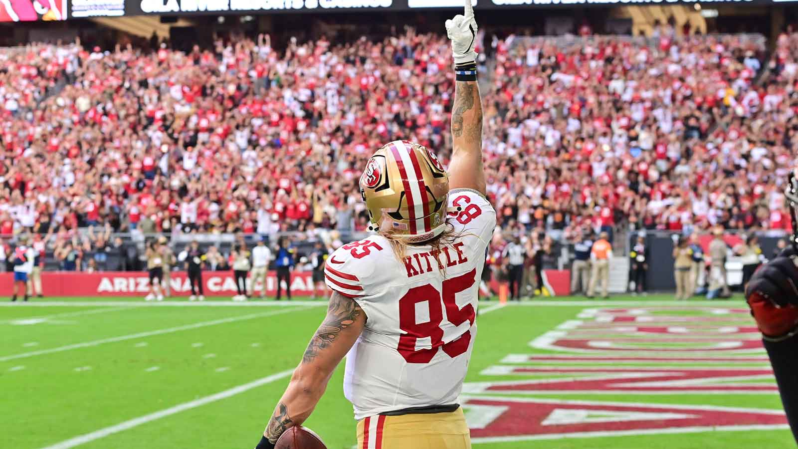San Francisco 49ers tight end George Kittle (85) celebrates a touchdown in the first quarter against the Arizona Cardinals at State Farm Stadium.