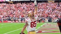 San Francisco 49ers tight end George Kittle (85) celebrates a touchdown in the first quarter against the Arizona Cardinals at State Farm Stadium.
