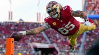 San Francisco 49ers tight end George Kittle (85) scores a touchdown during the fourth quarter against the Los Angeles Rams at Levi's Stadium.