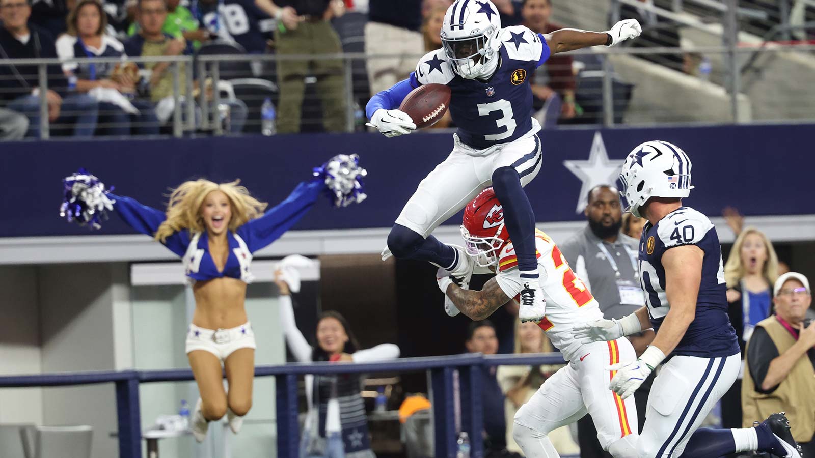 Dallas Cowboys wide receiver George Pickens (3) hurdles Kansas City Chiefs cornerback Trent McDuffie (22) during the fourth quarter at AT&T Stadium. 
