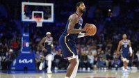 Philadelphia 76ers forward Paul George (8) shoots the ball against the Washington Wizards in the third quarter at Xfinity Mobile Arena.