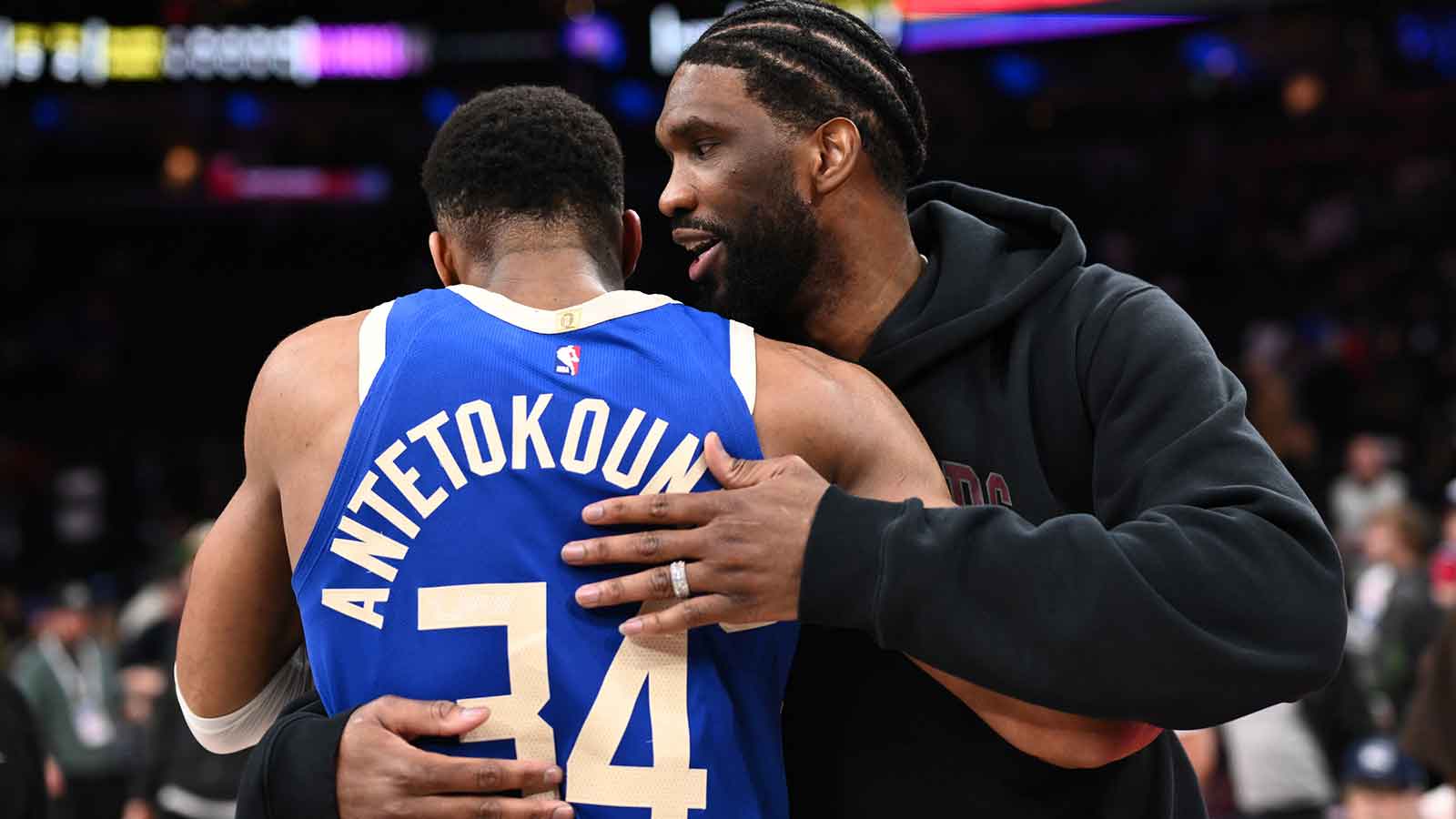 Philadelphia 76ers center Joel Embiid reacts with Milwaukee Bucks forward Giannis Antetokounmpo (34) after the game at Wells Fargo Center. 