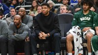 Milwaukee Bucks forward Giannis Antetokounmpo (34) watches the game against the Boston Celtics from the bench in the second quarter at Fiserv Forum.