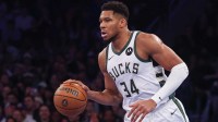 Milwaukee Bucks forward Giannis Antetokounmpo (34) dribbles up court during the first half against the New York Knicks at Madison Square Garden.