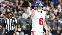 New York Giants quarterback Jaxson Dart (6) celebrates a touchdown in the second quarter against the Las Vegas Raiders at Allegiant Stadium.