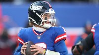 New York Giants quarterback Jaxson Dart (6) looks to pass during the second quarter against the Washington Commanders at MetLife Stadium.