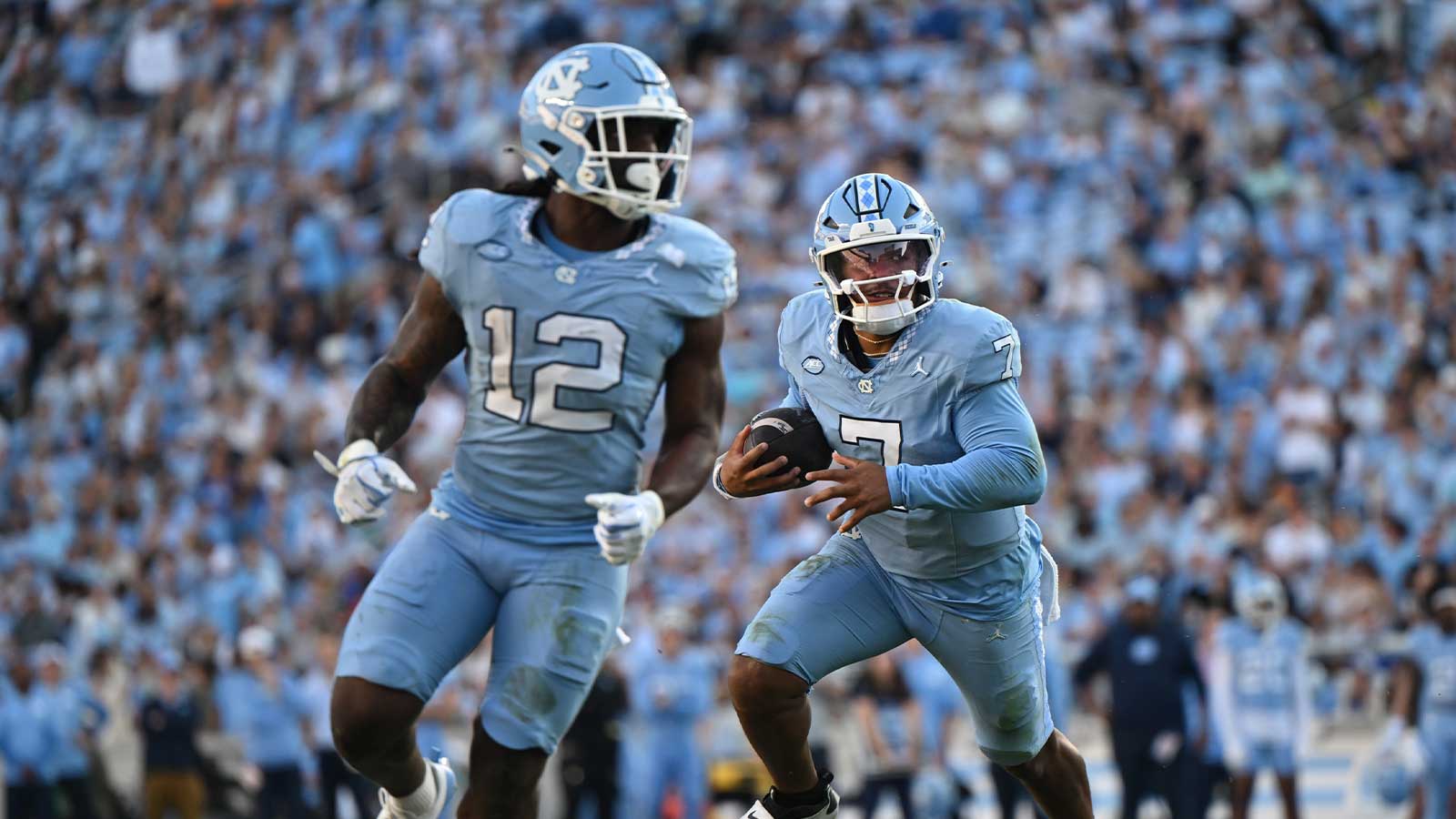 North Carolina Tar Heels quarterback Gio Lopez (7) rushes around the end during the first half against the Duke Blue Devils at Kenan Stadium.