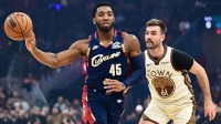 Cleveland Cavaliers guard Donovan Mitchell (45) passes as Golden State Warriors guard Pat Spencer (61) defends during the first half at Rocket Arena.