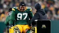 Green Bay Packers defensive tackle Jordon Riley (97) is carted off the field during the second quarter against the Baltimore Ravens at Lambeau Field. Mandatory Credit: Kayla Wolf-Imagn Images