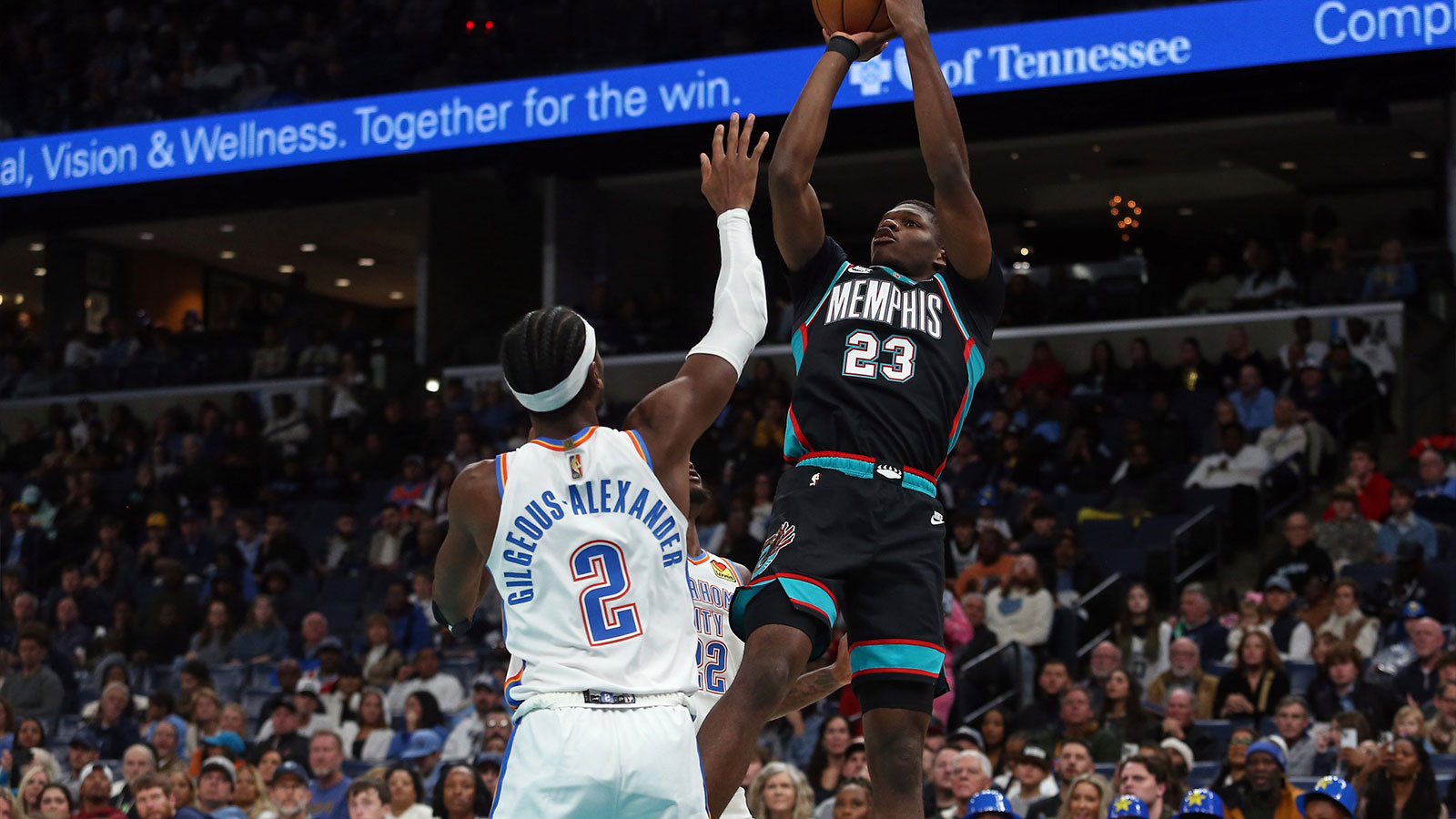 Memphis Grizzlies forward Cedric Coward (23) shoots as Oklahoma City Thunder guard Shai Gilgeous-Alexander (2) defends during the third quarter at FedExForum.