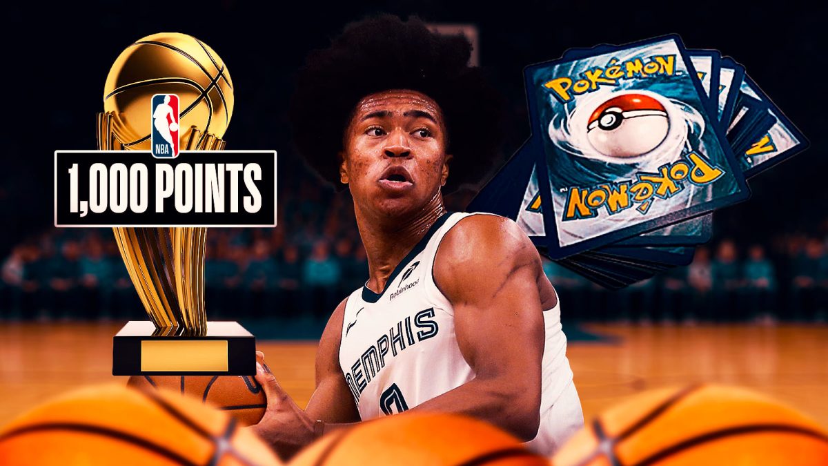 Grizzlies Jaylen Wells with Pokemon cards.