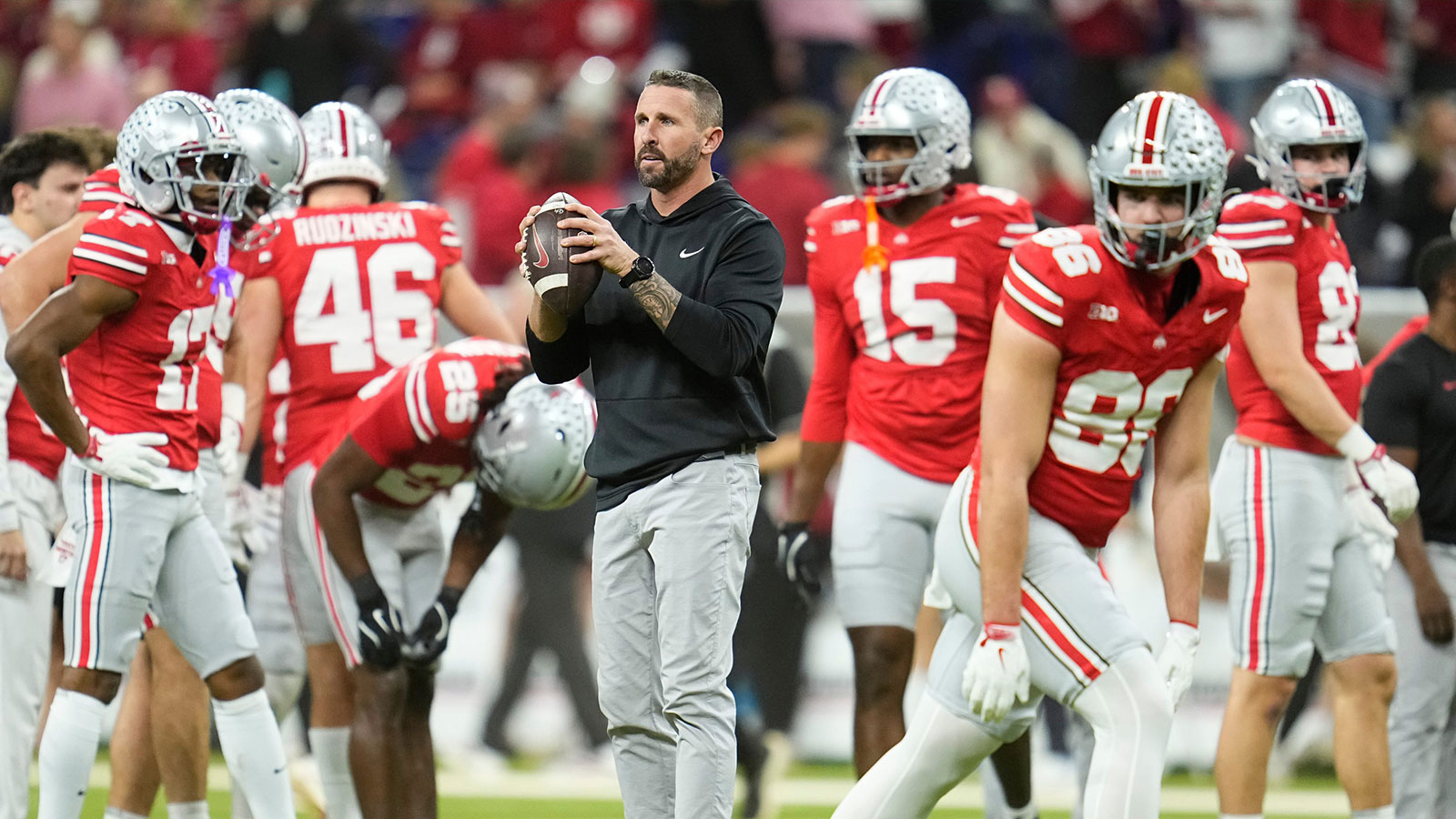 Ohio State Buckeyes offensive coordinator Brian Hartline warms up players during the Big Ten Conference championship game against the Indiana Hoosiers at Lucas Oil Stadium in Indianapolis on Dec. 6, 2025. Ohio State lost 13-10.