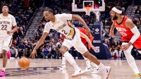 New Orleans Pelicans forward Herbert Jones (2) dribbles against Houston Rockets guard Josh Okogie (20) during the first half at Smoothie King Center.