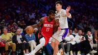 Houston Rockets forward Tari Eason (17) moves the ball against Los Angeles Lakers forward Jake LaRavia (12) during the second half at Crypto.com Arena.