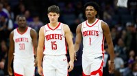 Houston Rockets guard Reed Sheppard (15) and guard Amen Thompson (1) walk off the court for a time out during the fourth quarter against the Sacramento Kings at Golden 1 Center.