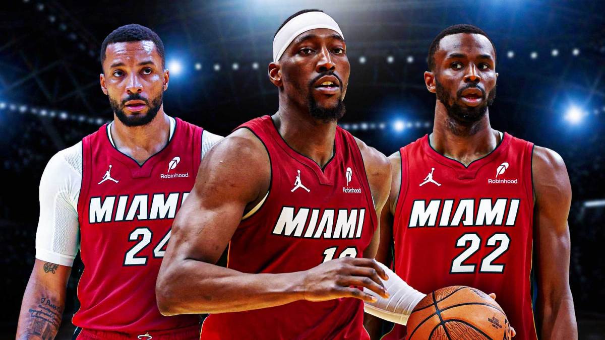 Miami Heat star Bam Adebayo in the center with Norman Powell and Andrew Wiggins on either side in front of Kaseya Center.
