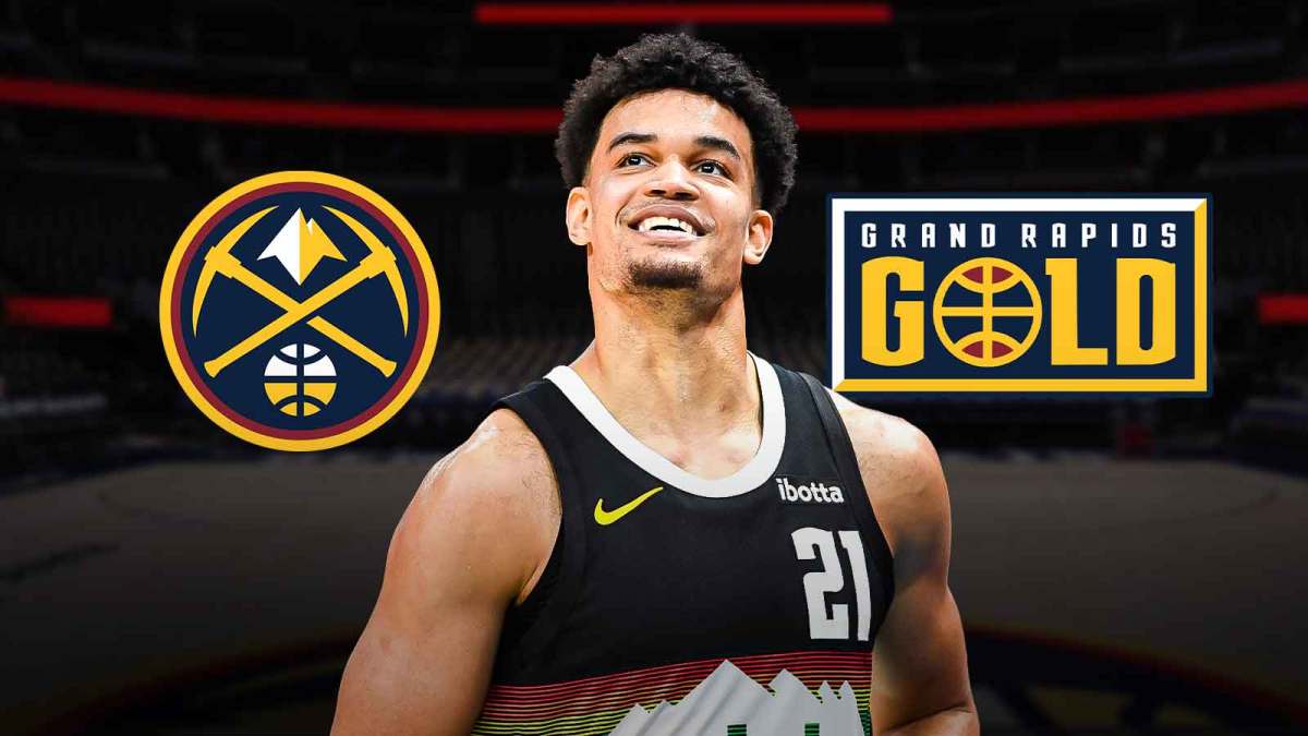 Spencer Jones smiling at Denver Nuggets, Grand Rapids Gold logos