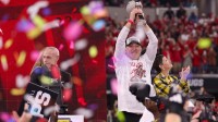 Texas Tech head coach Joey McGuire lifts the trophy as confetti starts to fall after the Red Raiders beat BYU 34-7 in Big 12 Championship football game, Saturday, Nov. 6, 2025, at AT&T Stadium in Arlington.