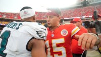 Philadelphia Eagles quarterback Jalen Hurts (1) and Kansas City Chiefs quarterback Patrick Mahomes (15) greet eachother after the game at GEHA Field at Arrowhead Stadium