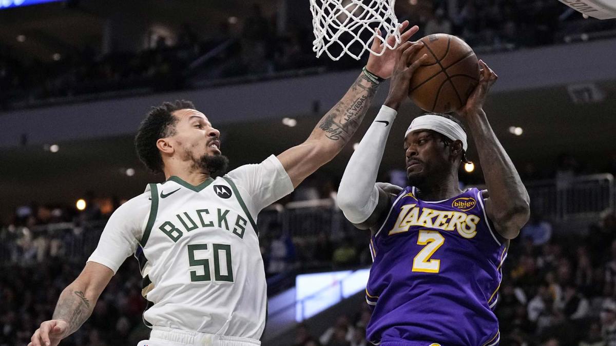 Los Angeles Lakers forward Jarred Vanderbilt (2) grabs a rebound as Milwaukee Bucks guard Cole Anthony (50) reaches for the ball during the second quarter at Fiserv Forum.