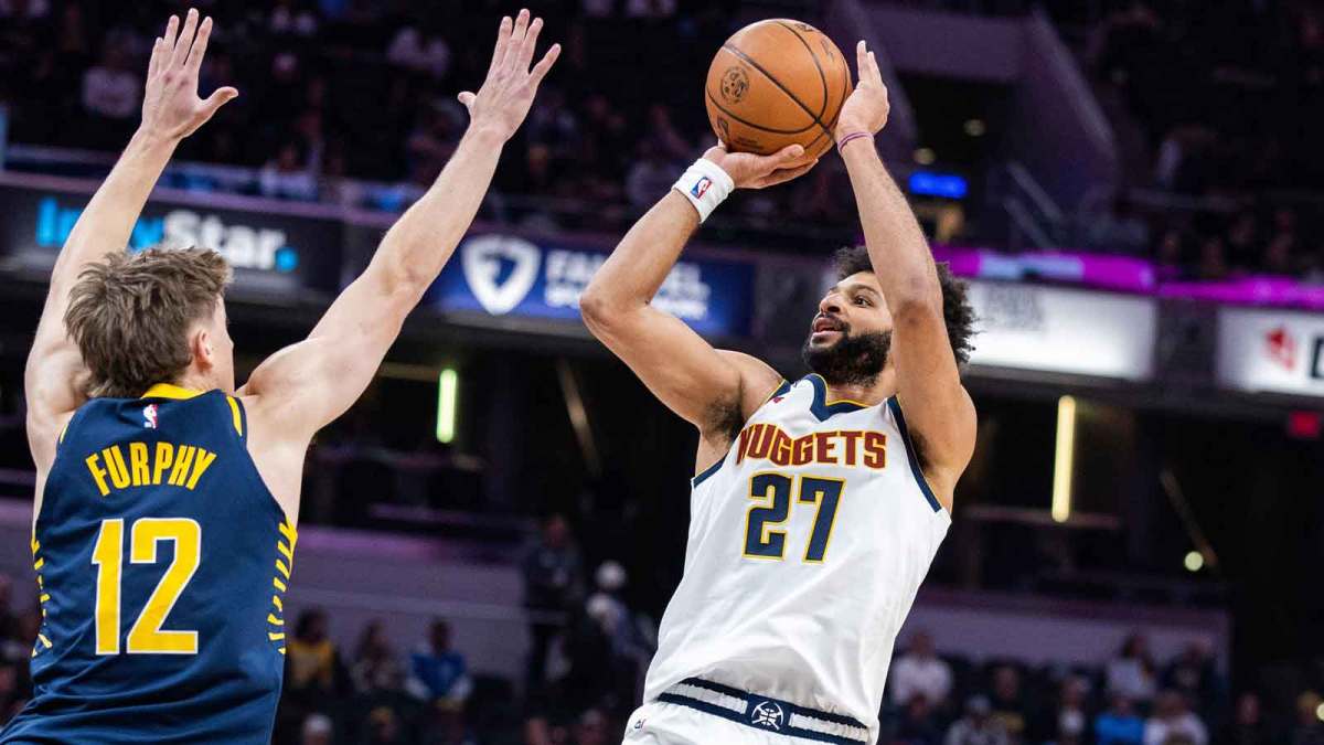 Denver Nuggets guard Jamal Murray (27) shoots the ball while Indiana Pacers guard Johnny Furphy (12) defends in the first half at Gainbridge Fieldhouse.