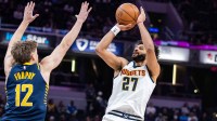 Denver Nuggets guard Jamal Murray (27) shoots the ball while Indiana Pacers guard Johnny Furphy (12) defends in the first half at Gainbridge Fieldhouse.