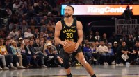 Golden State Warriors guard Stephen Curry (30) shoots a three-pointer against the Houston Rockets in the second quarter at Chase Center.