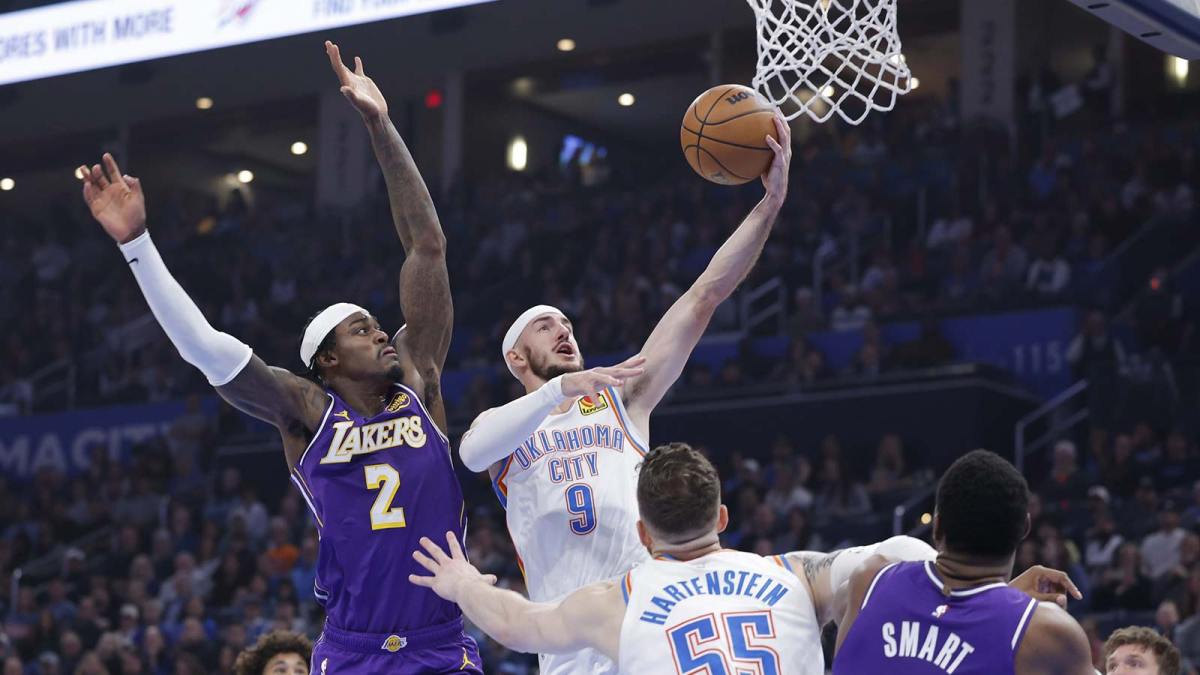 Oklahoma City Thunder guard Alex Caruso (9) goes up for a basket beside Los Angeles Lakers forward Jarred Vanderbilt (2) during the second quarter at Paycom Center.