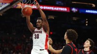 Arizona Wildcats forward Tobe Awaka (30) slam dunks the ball against the San Diego State Aztecs in the second half during the Hall of Fame Series at Mortgage Matchup Center.