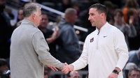 Purdue Boilermakers head coach Matt Painter and Auburn Tigers head coach Steven Pearl shake hands after the game at Gainbridge Fieldhouse.